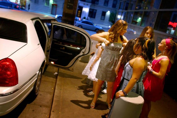 Girls going to prom in a limousine