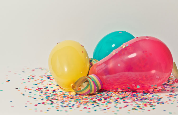 three colorful balloons on the floor